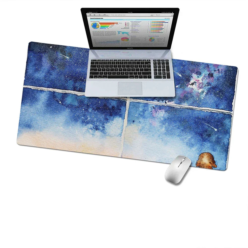 Galaxy print desk mat with laptop and wireless mouse, modern workspace accessory