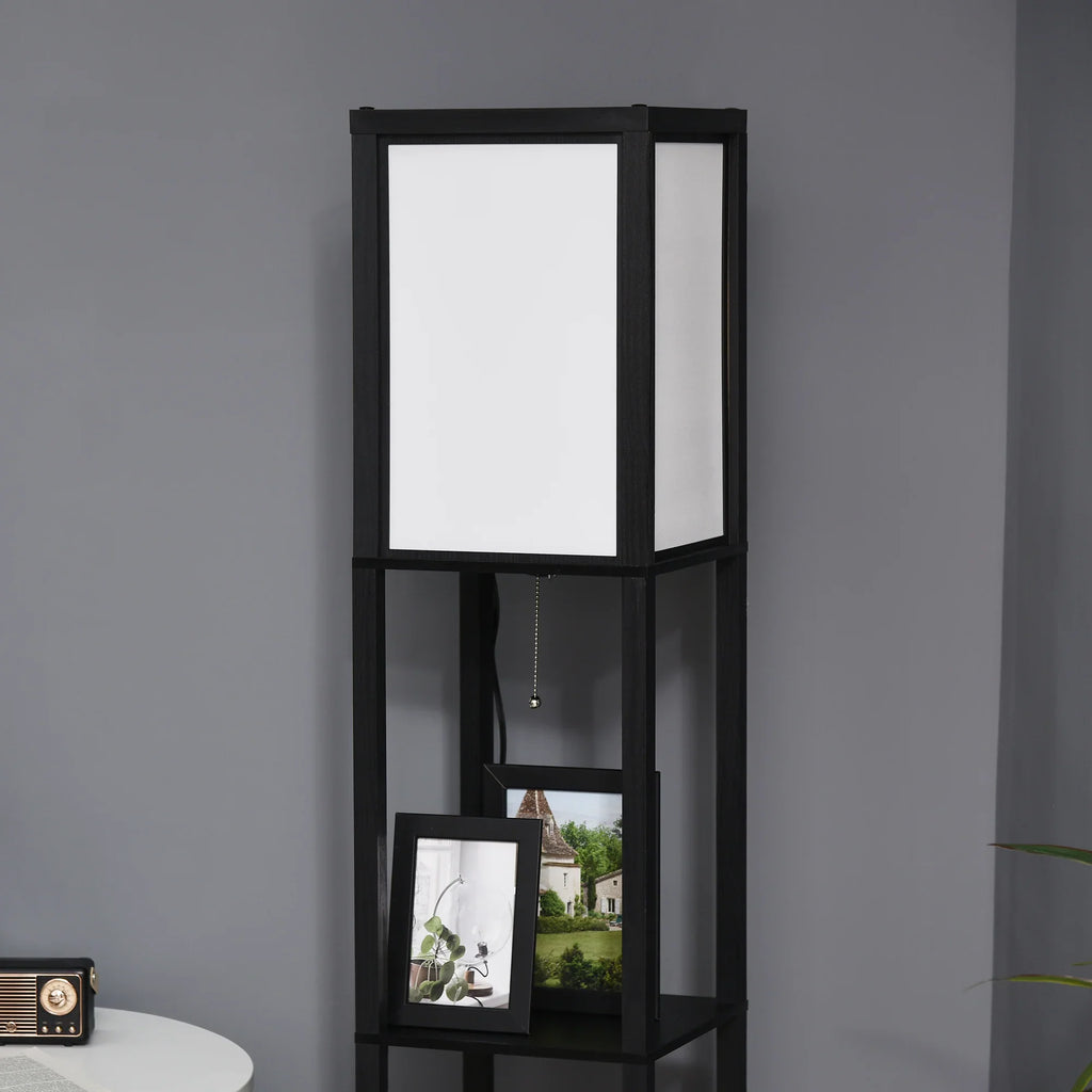 Modern black floor lamp with built-in shelves and framed photos, studio decor