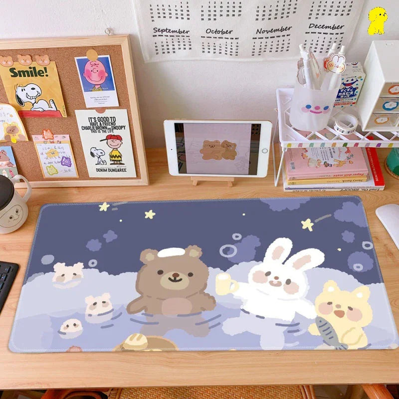 Cute cartoon animal mouse pad on a tidy workspace with organized desk accessories and tablet.