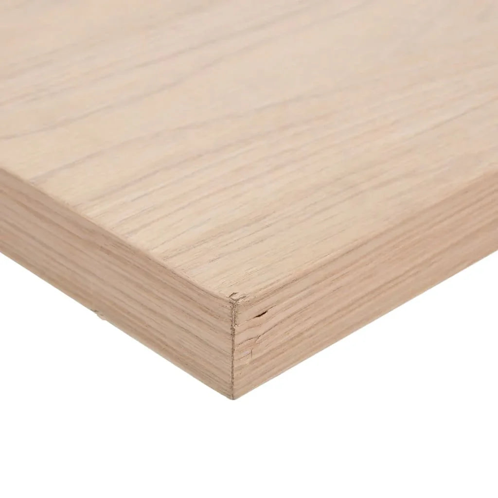 Close-up of a light wood desk corner with natural grain, minimalist workspace surface.