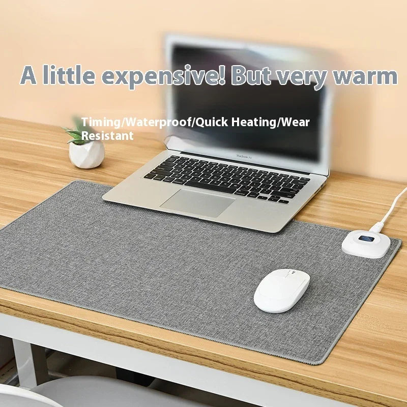 Heated waterproof desk mat with laptop, mouse, and controller on modern workspace