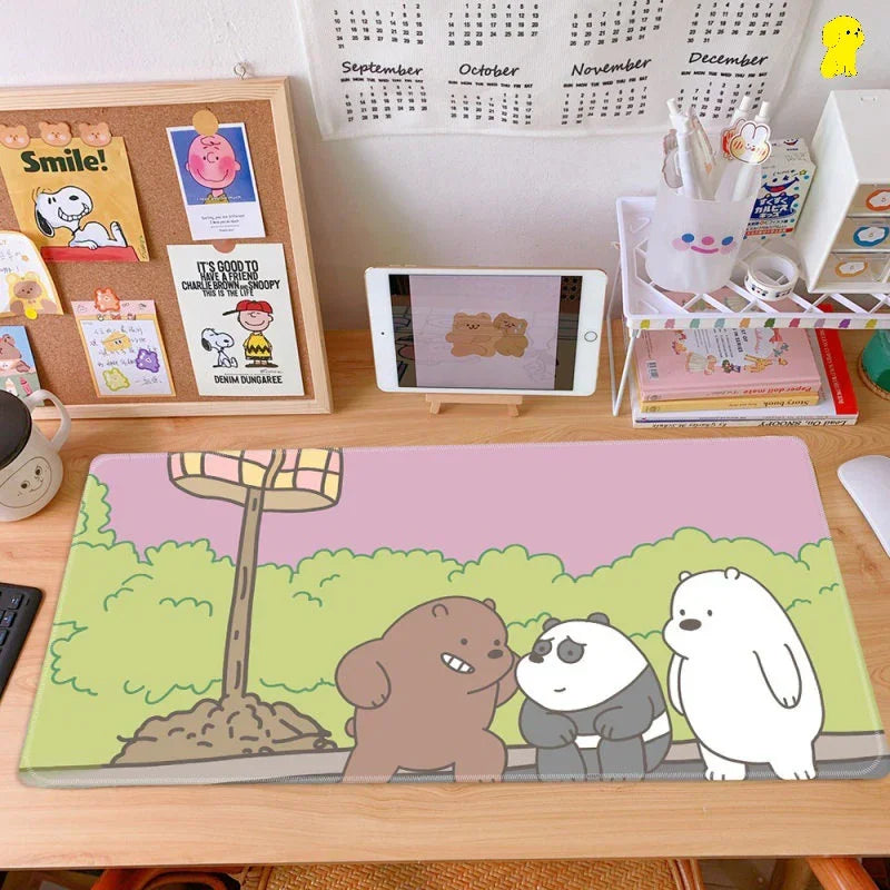 Cute bear cartoon desk mat on tidy workspace with tablet, calendar, and stationery organizers