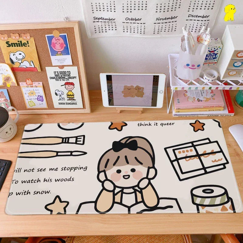 Cute cartoon girl desk mat on organized workspace with calendar, art supplies, and books