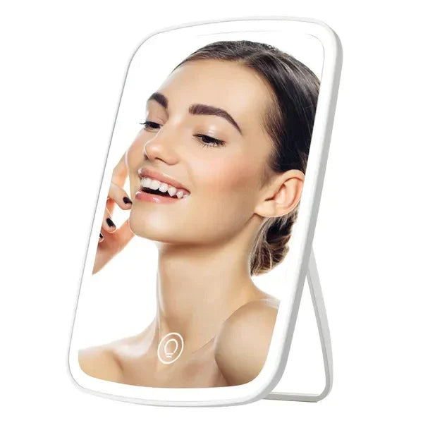 LED vanity mirror with adjustable stand reflecting woman applying makeup
