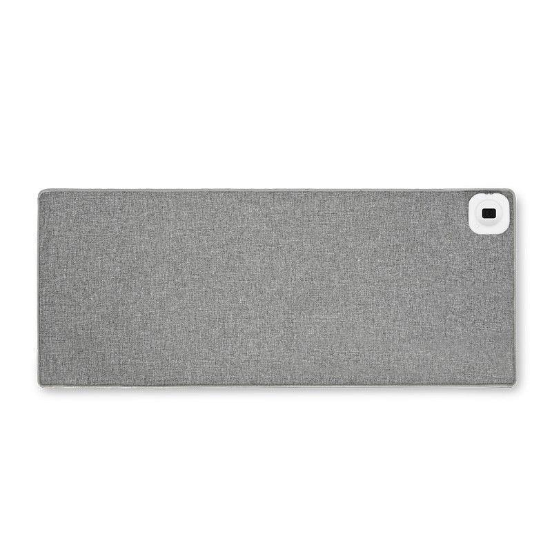 Gray ergonomic desk mat with fabric texture and square white accent, ideal for office setup